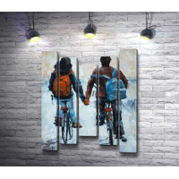Парень и девушка на велосипедах держатся за руки