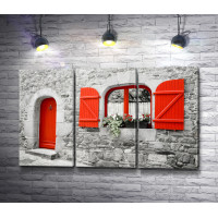 Красные двери в доме из камней
