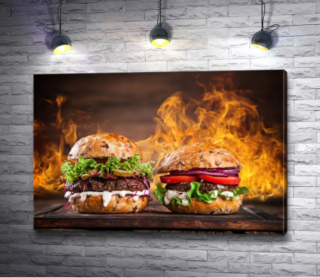 Два бургера на фоне огня