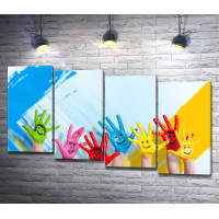 Детские руки разных цветов с нарисованными улыбками