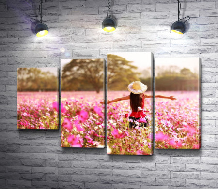 Девушка в шляпе в цветочном поле 