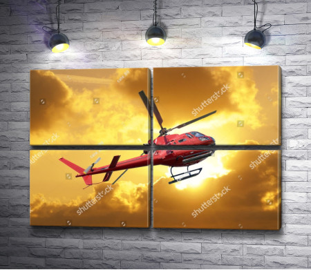 Красный вертолет в облаках на закате 
